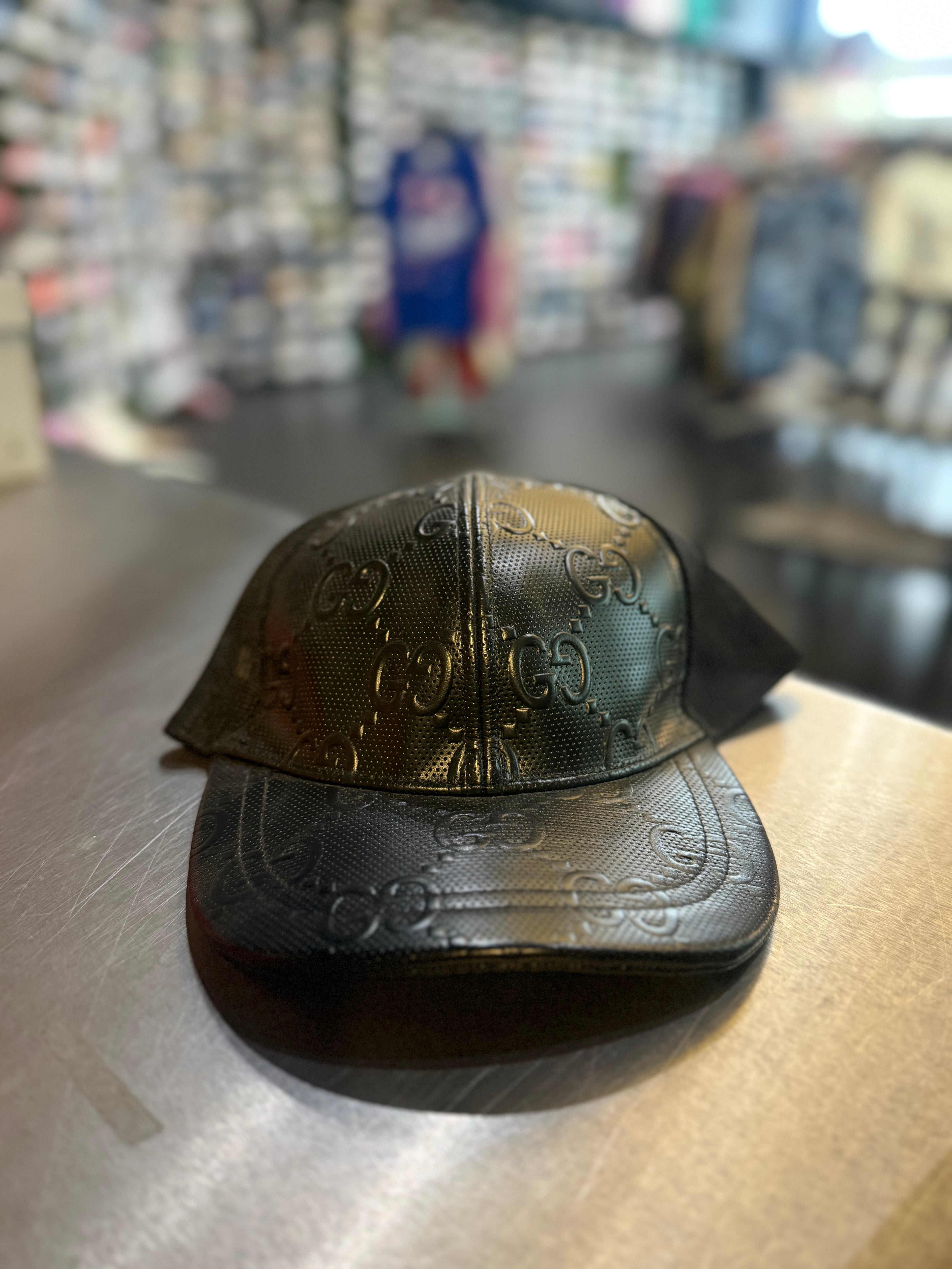 Gucci leather print hat