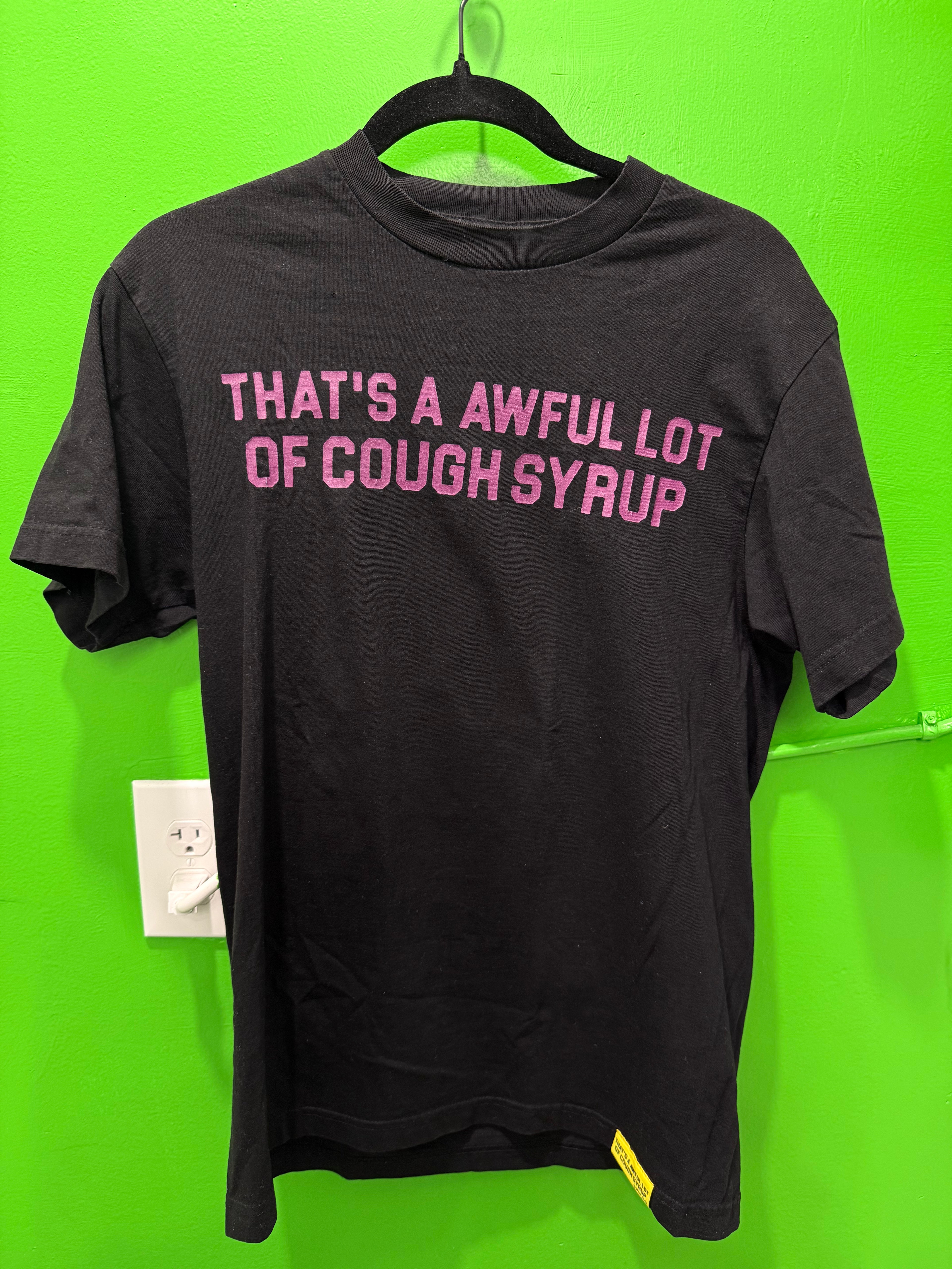 Awful lot of cough syrup, black, and purple ￼